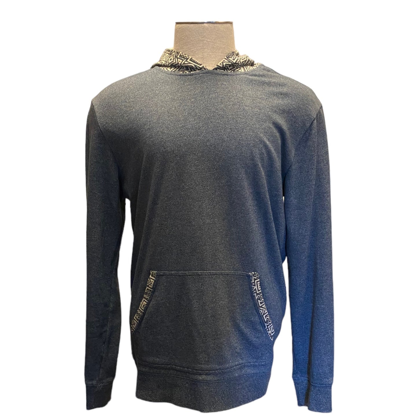 Blue hoodie with decorative trim on a mannequin against a white background