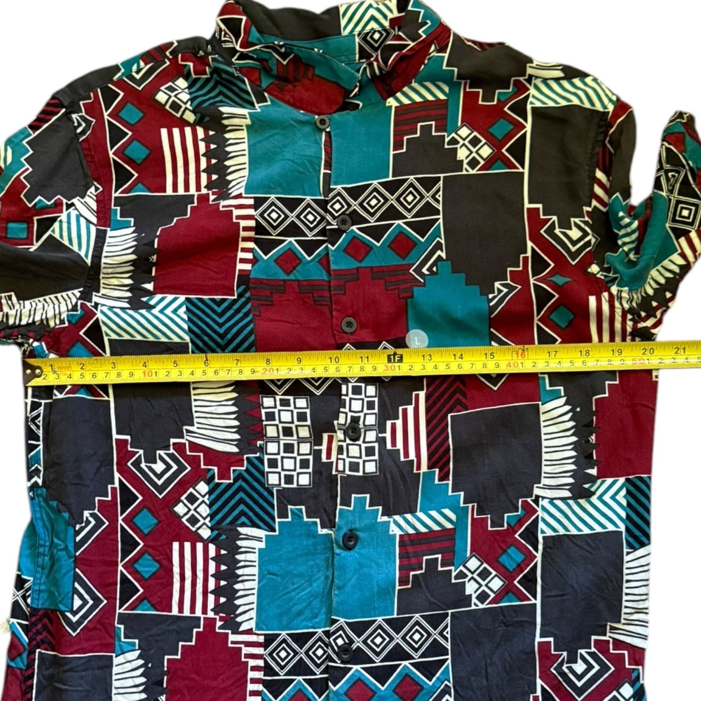 Colorful patterned shirt with a measuring tape for scale