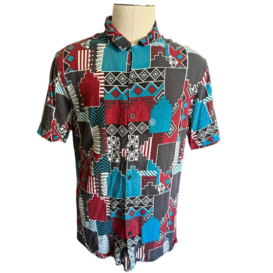 Colorful patterned shirt on a mannequin against a white background