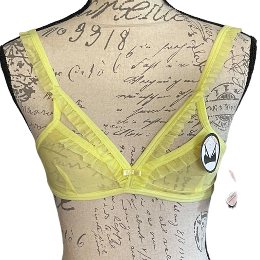 Green bra on a mannequin with vintage-style text background