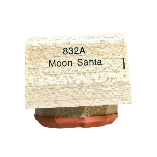 A small rectangular wooden block labeled '832A Moon Santa' with a reddish-brown base, shown on a plain white background.