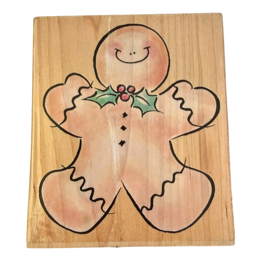 Wooden board with a gingerbread man design on a white background