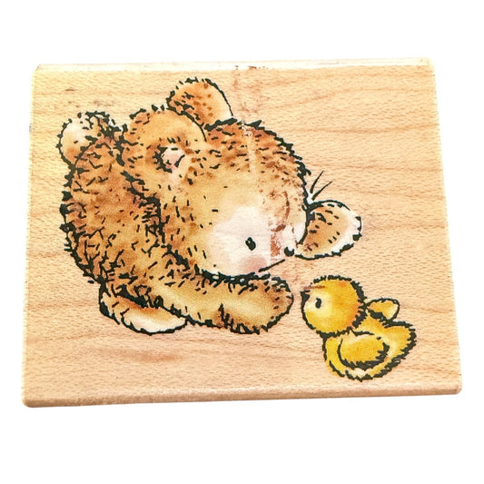 Front Of bunny and baby chic rubber stamp on a wood block with a white background. 
