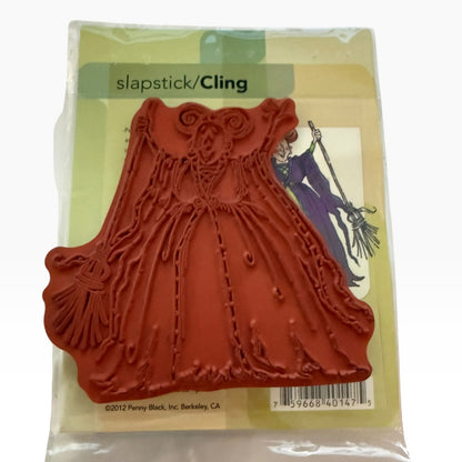 A red rubber stamp in its original packaging, featuring a witch design . 
