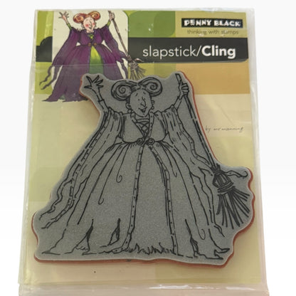Penny Black slapstick/Cling rubber stamp featuring a witch in a long dress holding a broom, shown in its retail packaging.