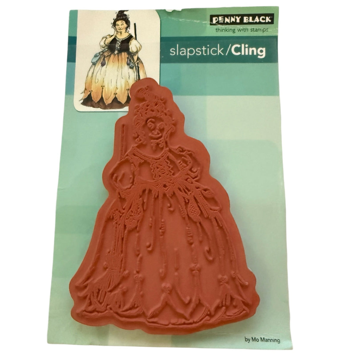 Back of a Penny Black cling stamp on a green backing showing the back of a witch stamp on a white background 