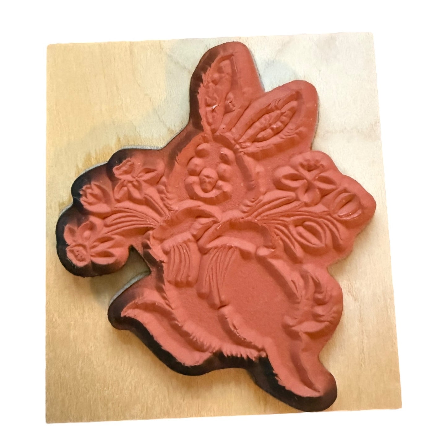 Floral and rabbit design stamp on a wooden block