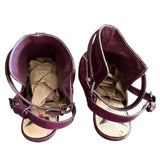 Top of maroon strappy heels on a white background