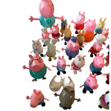 Collection of colorful animal figurines on a white background