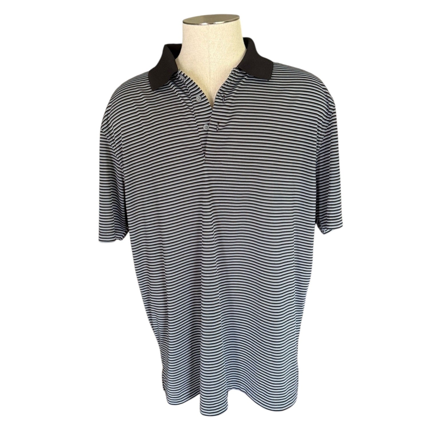 Black and white striped polo front of shirt on a mannequin against a white background