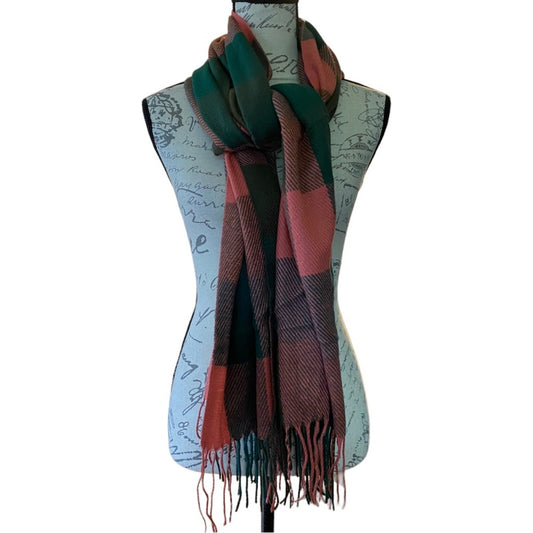 A plaid scarf in dark green, pink, and black, draped on a dress form mannequin against a white background.