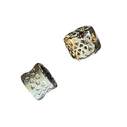 side of 2 charms to show design on a white background