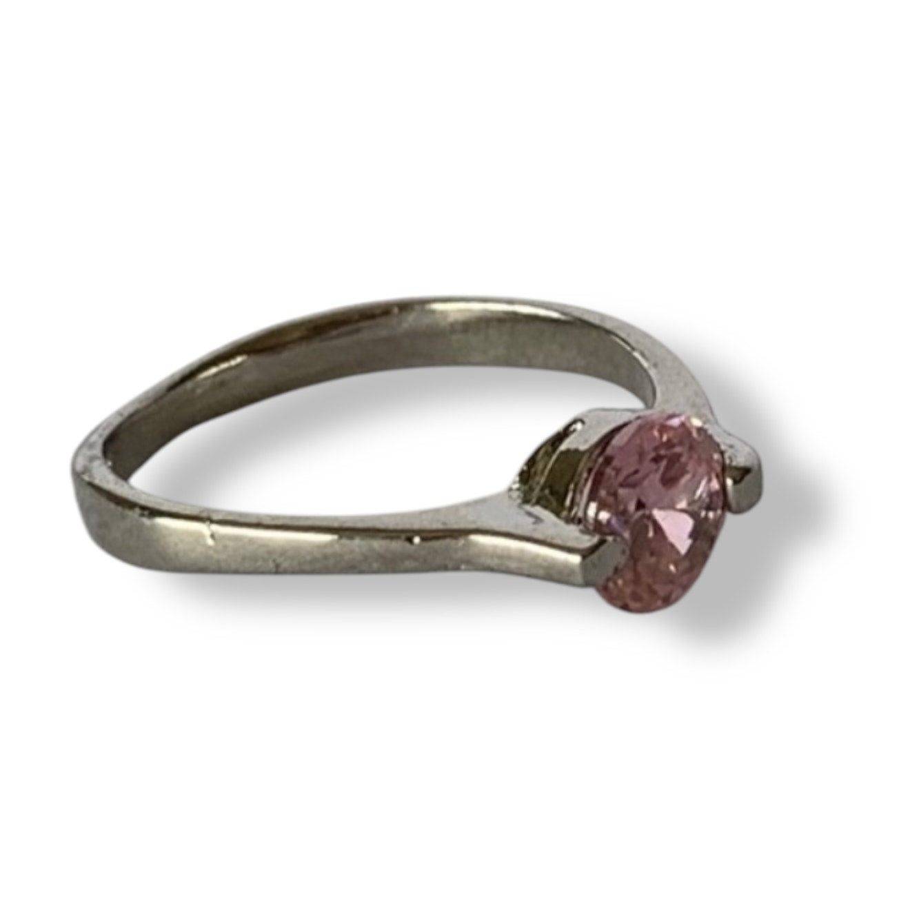 Silver ring with a pink gemstone on a white background