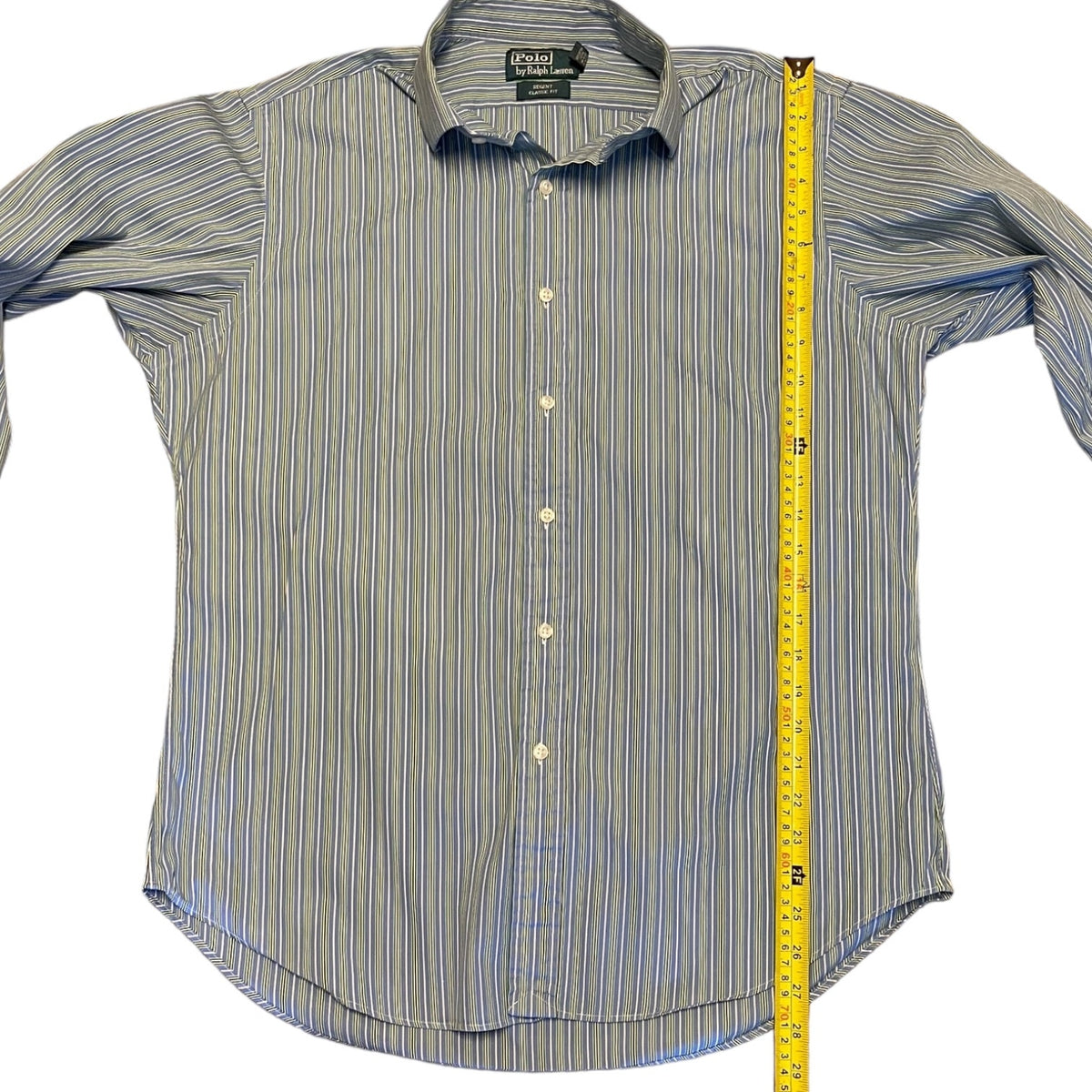 Striped shirt with a measuring tape on a white background