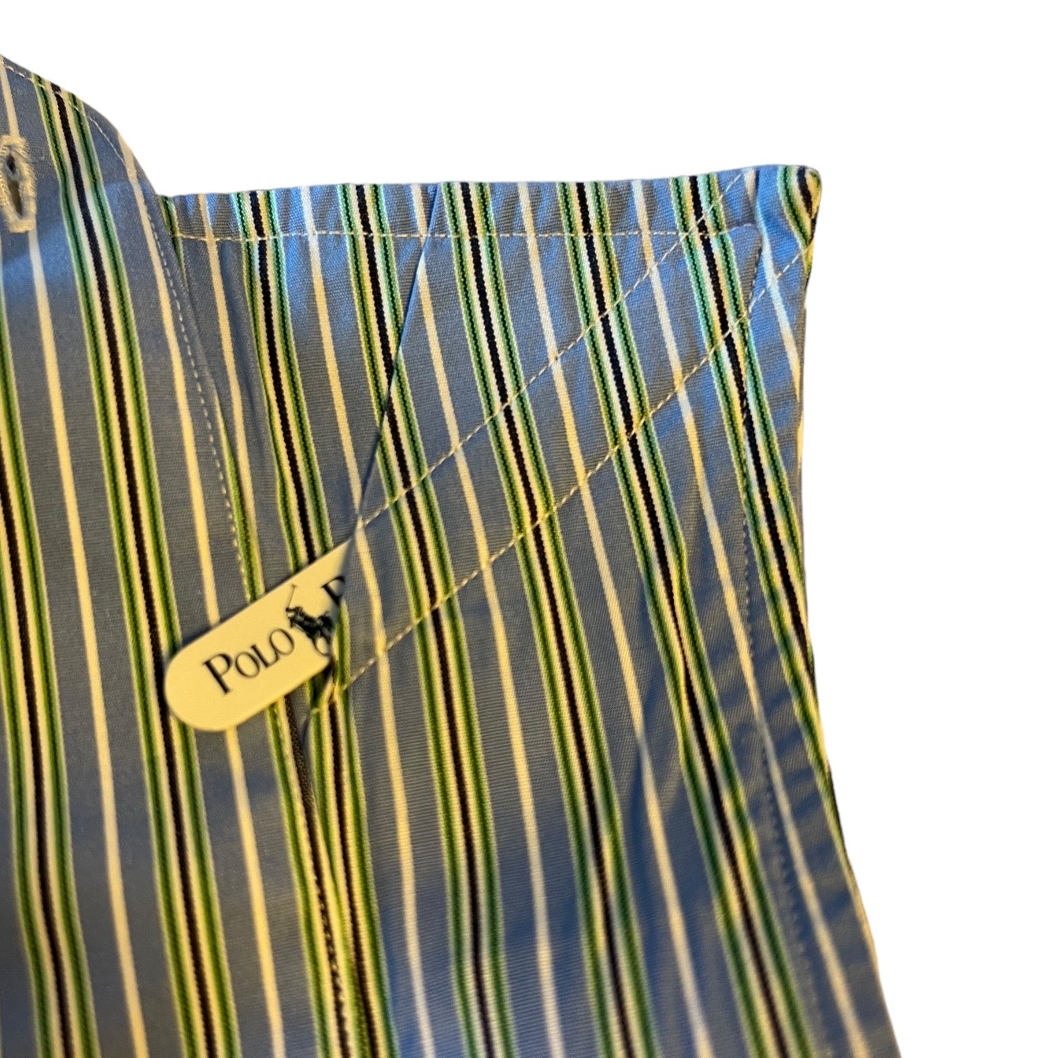 Close-up of a striped fabric with a Polo Ralph Lauren logo .