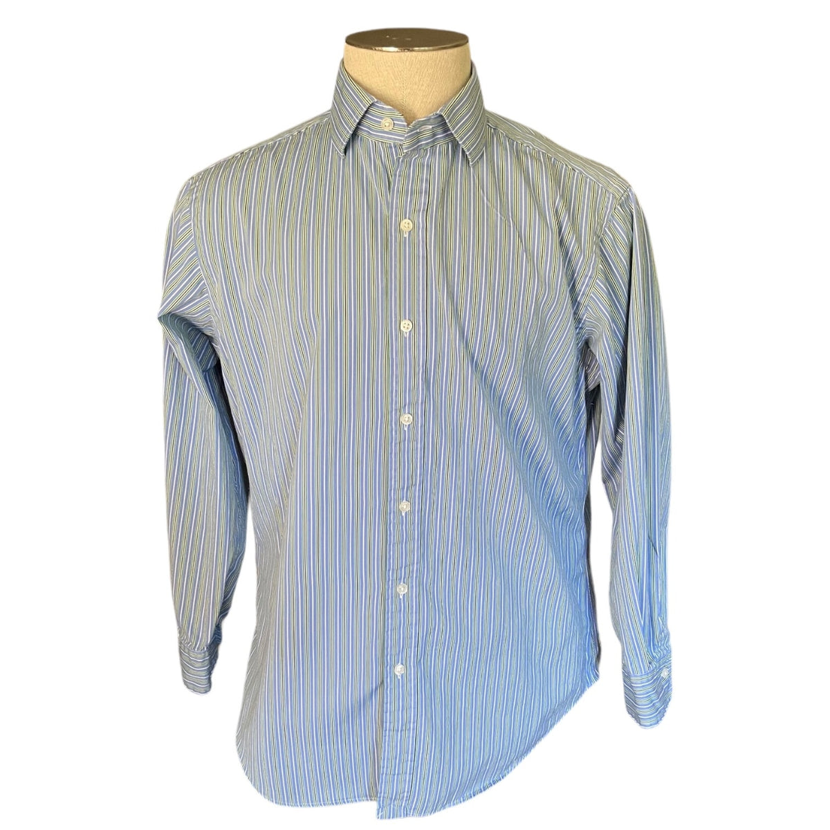 Blue and white striped shirt on a mannequin with a white background