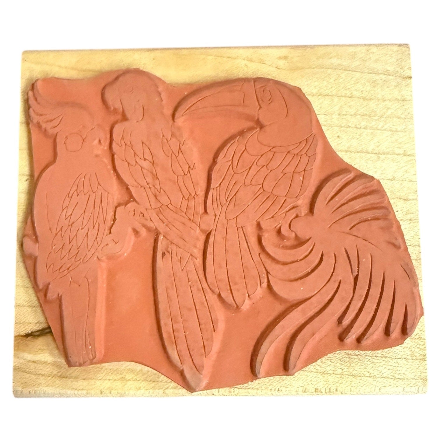 Rubber stamp with parrot design on a wooden block