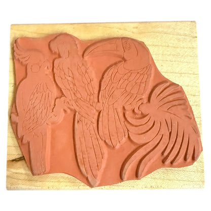 Rubber stamp with parrot design on a wooden block