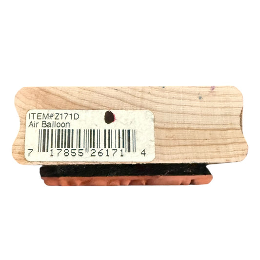Wooden air balloon stamp with a label on a white background