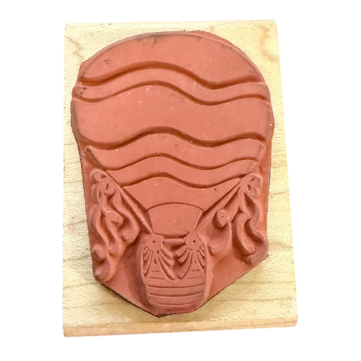 Red rubber stamp with a hot air balloon  design on a wooden block