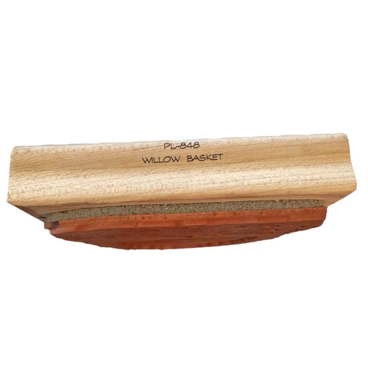 Willow basket printed on side of wood block on a white background. 
