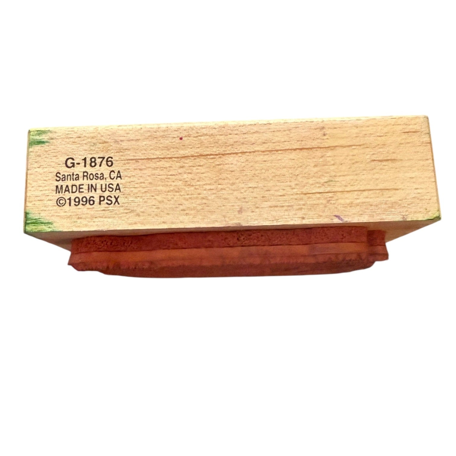 Wooden stamp block with branding text on a white background