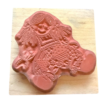 Decorative rubber stamp on a wooden block
