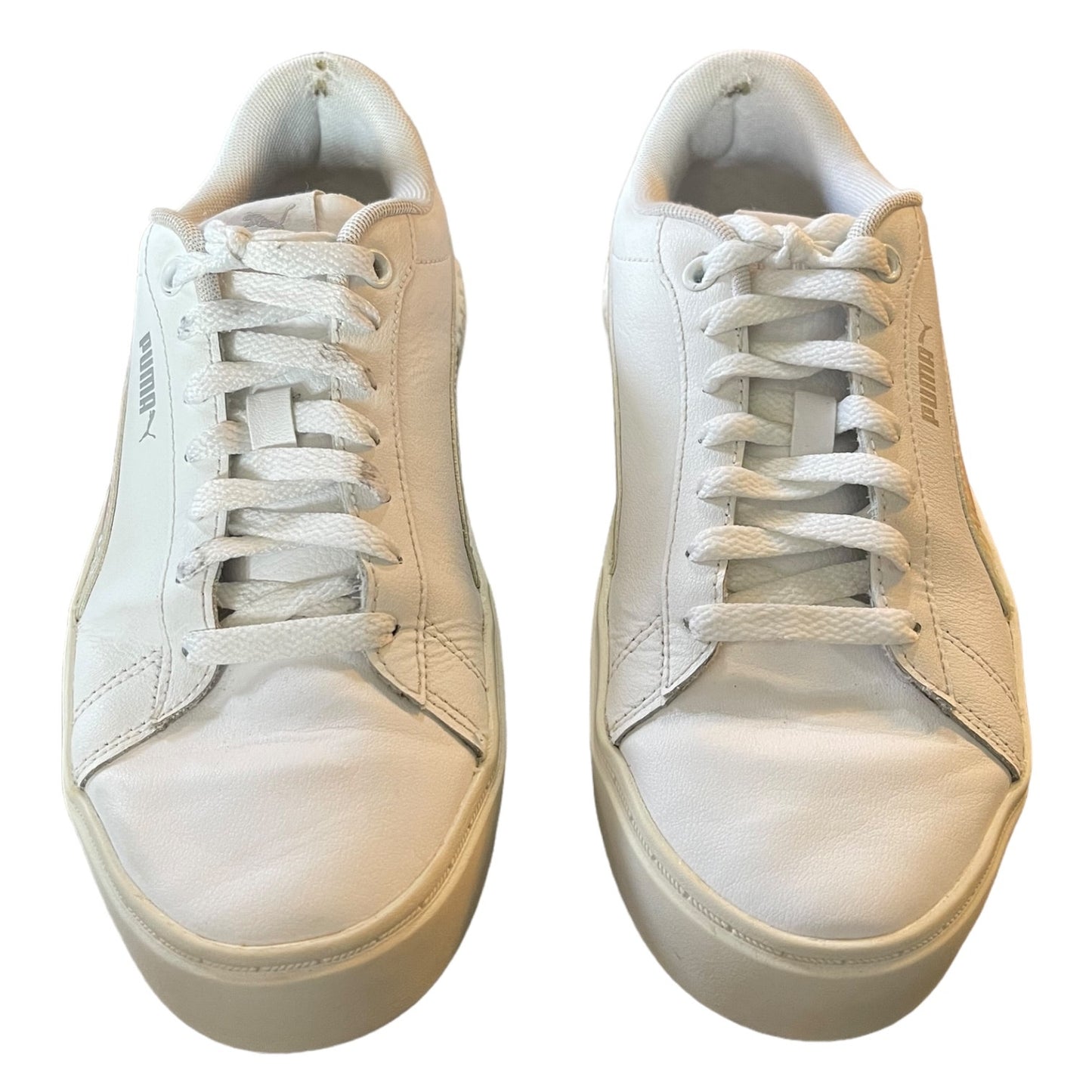 front of a Pair of white sneakers on a white background
