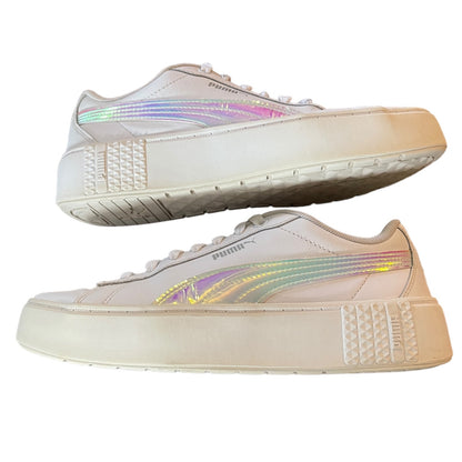 White sneakers with rainbow accents on a white background