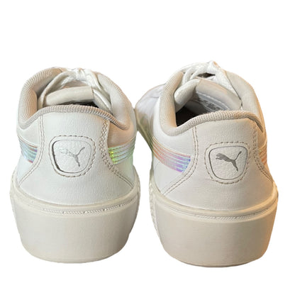 Back of White sneakers with a brand logo on a white background