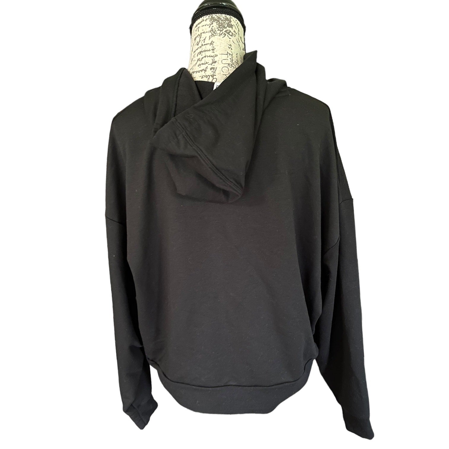 Back of Black hoodie on a mannequin with a white background