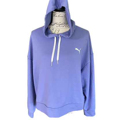 A lavender-purple Puma pullover hoodie displayed on a vintage-style dress form mannequin against a plain white background.
