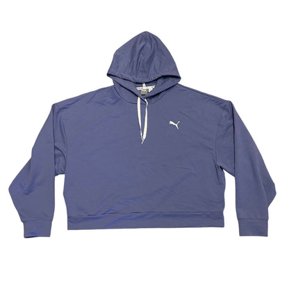A Puma cropped pullover hoodie in a purple color, featuring white drawstrings and a white embroidered Puma logo on the left chest, laid flat against a white background.