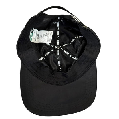 Black cap with Puma branding on a white background