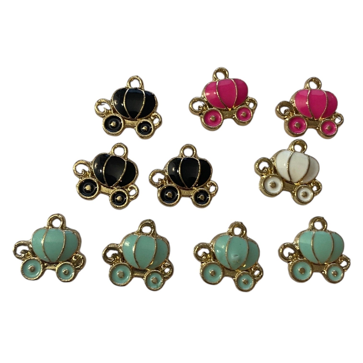 Set of colorful pumpkin carriage charms on a white background