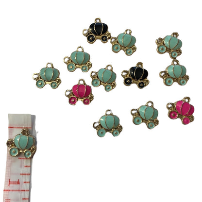 Colorful carriage-shaped charms on a white background with a measuring tape for scale.