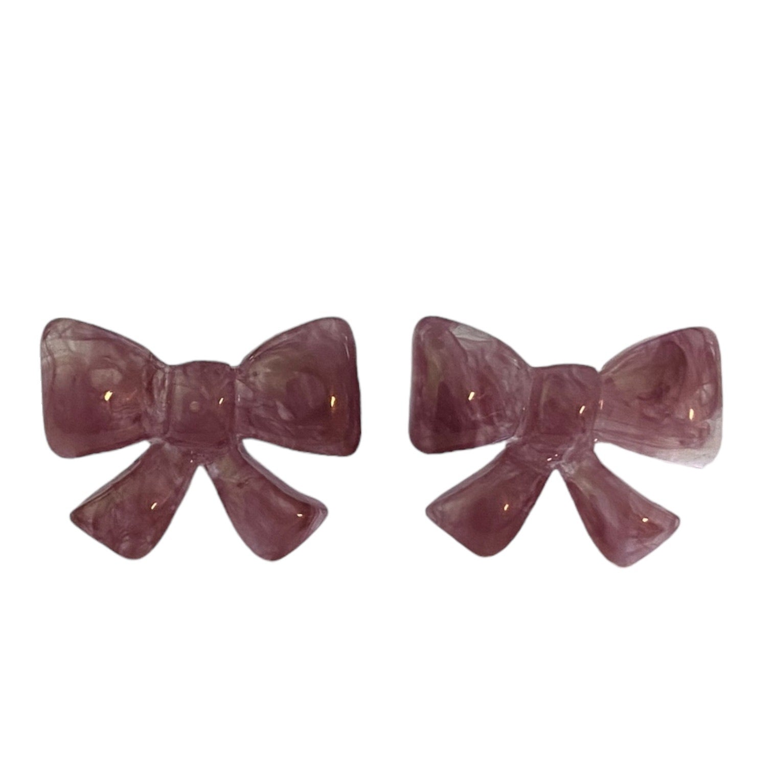 Pair of purple bow-shaped earrings on a white background