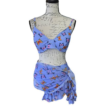 Front of purple butterfly-patterned three-piece outfit on a mannequin against a white background