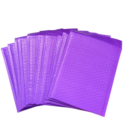 Purple bubble mailers stacked on a white background