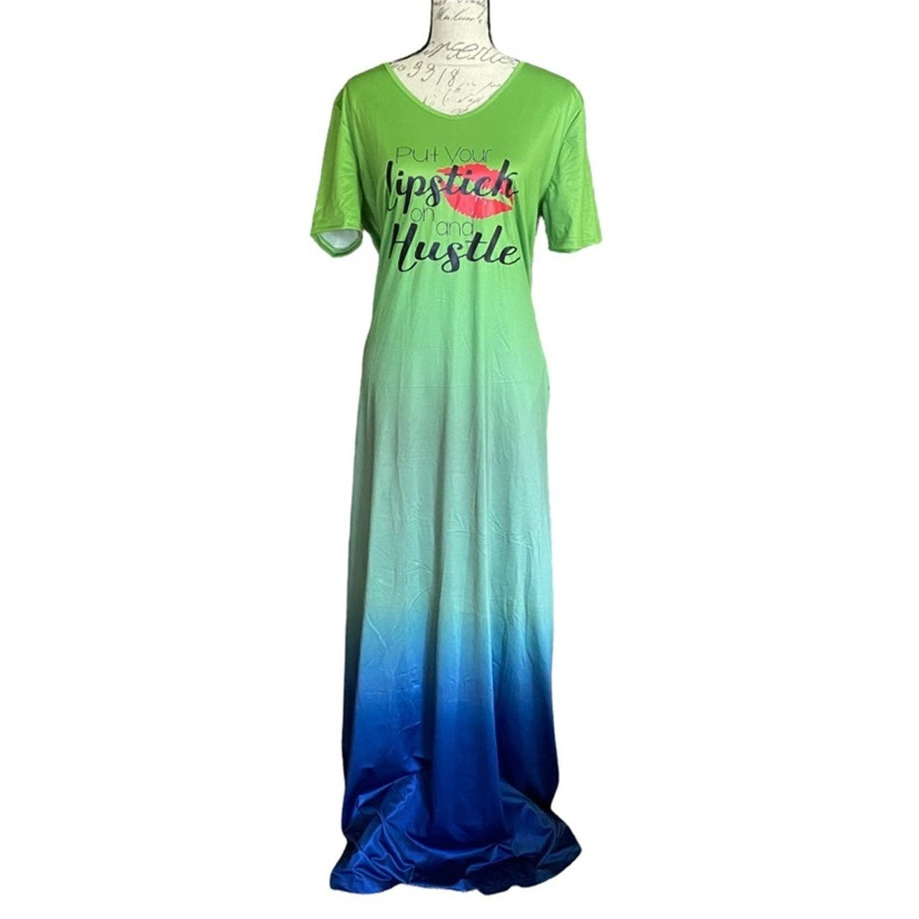 Front of Green to blue gradient dress with text on a white background