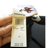 Quiksilver clothing tag held by a hand with a blurred background