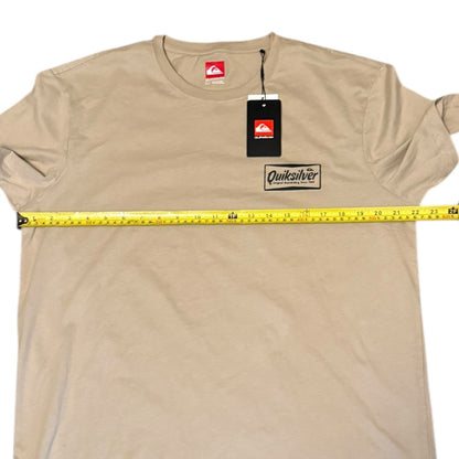 Beige t-shirt with Quiksilver logo and measuring tape on a white background