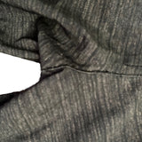 Close-up of repair on fabric with a white background