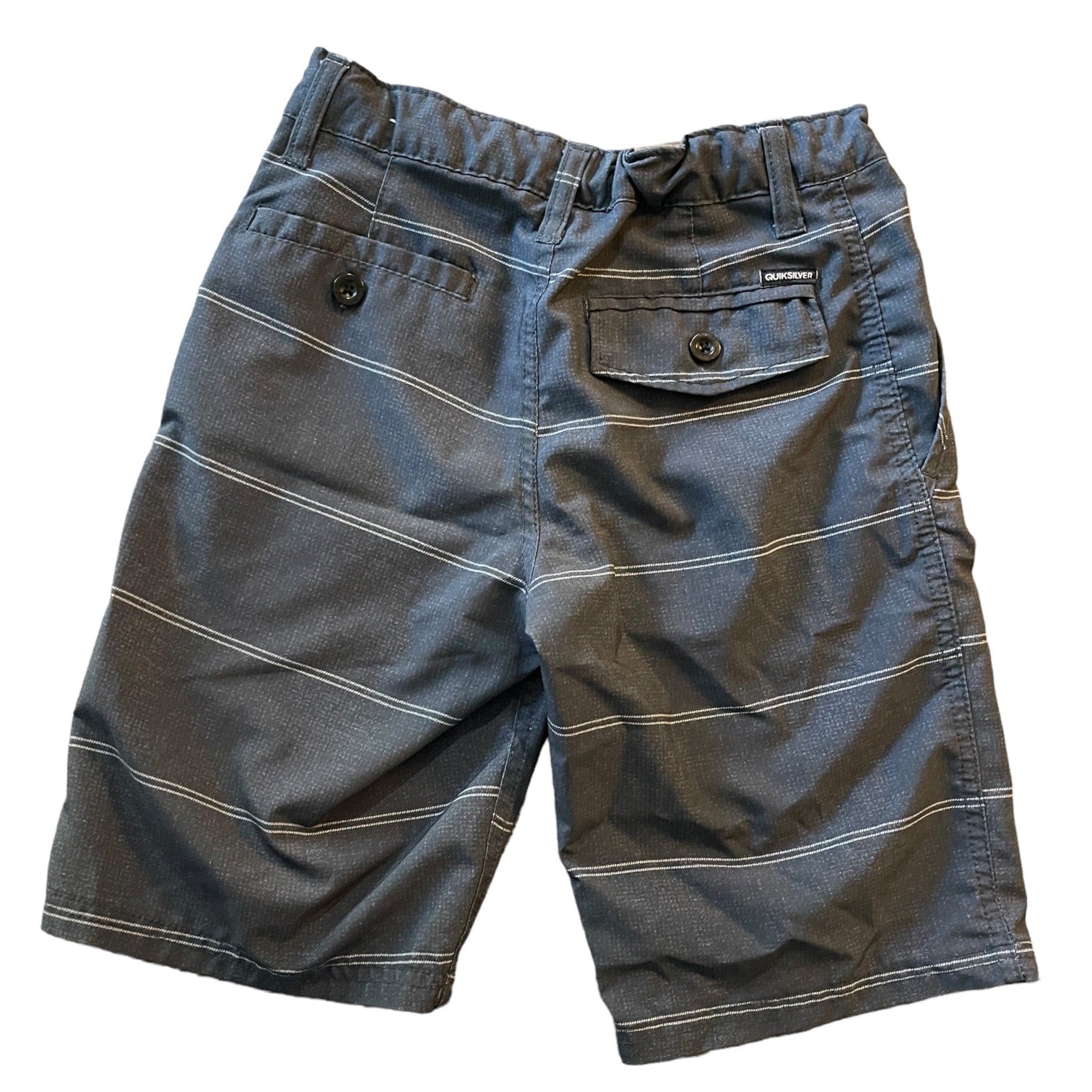 Back of gray striped shorts on a white background