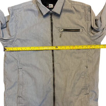 Striped jacket with a measuring tape across it on a white background