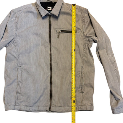 Striped jacket with a measuring tape for size reference on a white background
