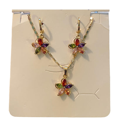 Flower-shaped jewelry set with multicolored stones on a display card.