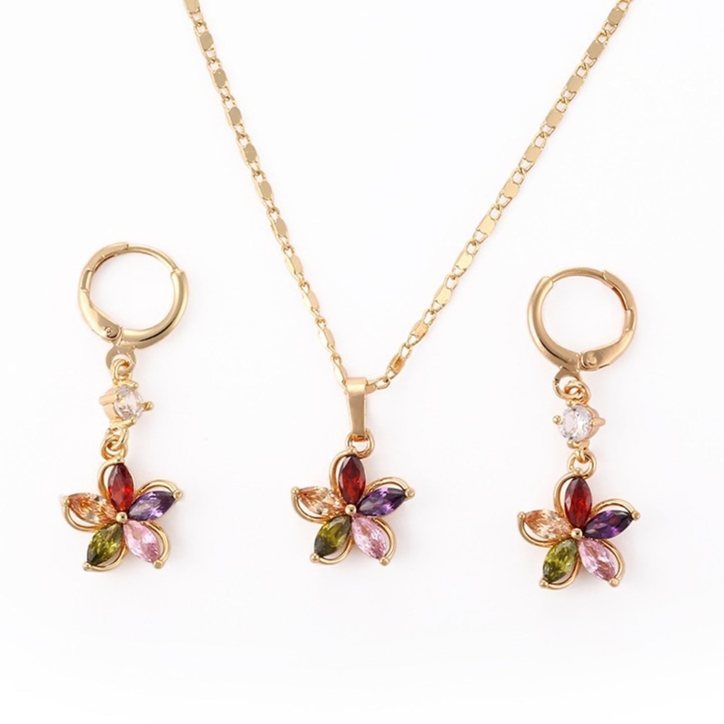 Gold flower necklace and earrings with multicolored faux gemstones on a white background