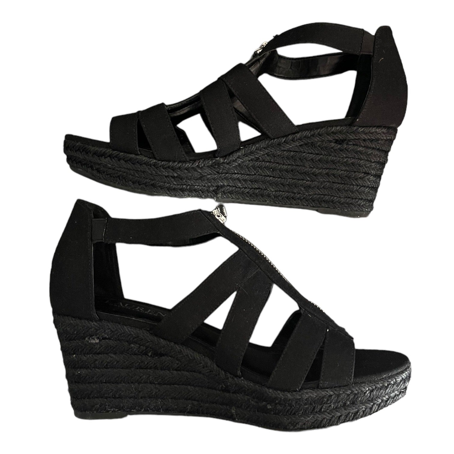 Black wedge sandals with espadrille sole on a white background