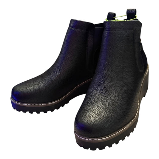 Pair of black faux leather ankle boots front side on a white background